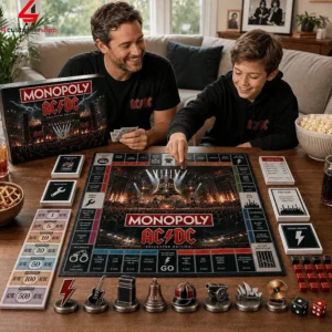 Father and son playing AC/DC Monopoly collector edition board game.