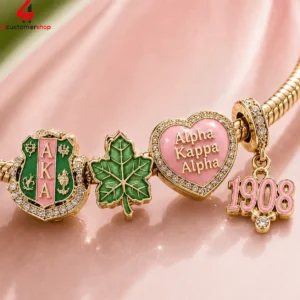 Alpha Kappa Alpha sorority themed charm bracelet with gold and enamel accents.