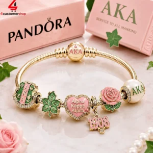 Gold charm bracelet with Alpha Kappa Alpha sorority symbols and pink rose details