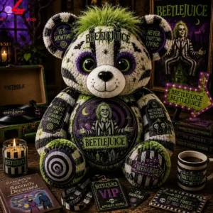 Beetlejuice themed plush teddy bear surrounded by movie-inspired collectibles.