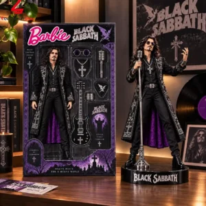 Black Sabbath themed Barbie collector doll with accessories on a wooden desk