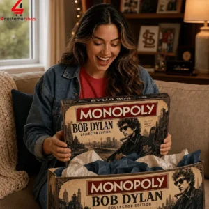 A woman excitedly opening a Bob Dylan Collector Edition Monopoly game box