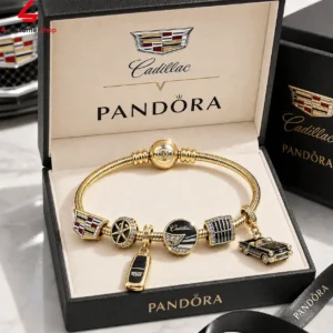 Gold Pandora bracelet with Cadillac themed charms in a branded presentation box.