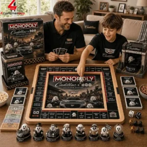 Father and son playing a Cadillac-themed Monopoly collector edition board game at home.