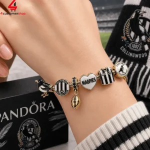 Collingwood Magpies themed gold charm bracelet on a wrist.