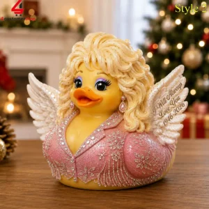 Dolly Parton-themed rubber duck collectible with angel wings and commemorative inscription.