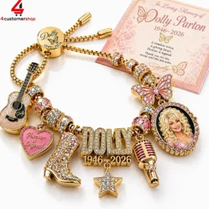 Commemorative Dolly Parton gold-tone charm bracelet with music-themed icons