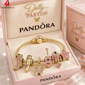 Dolly Parton Pandora charm bracelet set in a pink jewelry box.