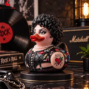 Rubber duck figure with black curly hair and leather-themed outfit on a display stand