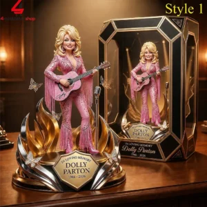 Dolly Parton memorial figurine in pink rhinestone suit with guitar