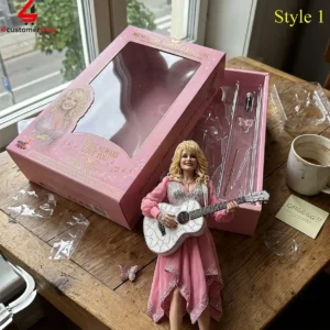 Dolly Parton collectible figure in pink dress with acoustic guitar and memorial packaging