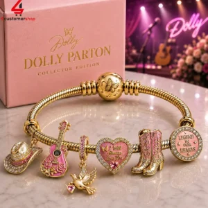 Dolly Parton collector edition charm bracelet with music-themed gold and pink charms.
