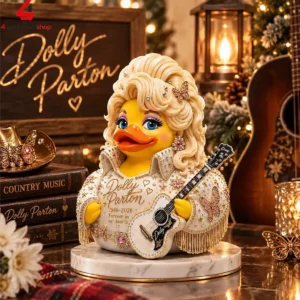 A decorative rubber duck styled as Dolly Parton with a white rhinestone suit and guitar.