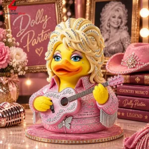 Dolly Parton themed collectible duck figure in a pink rhinestone outfit holding a guitar.