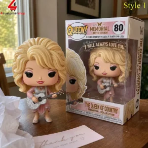 Dolly Parton collectible figure with guitar next to its limited edition box