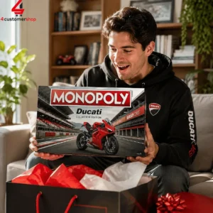 A man excitedly holding a Monopoly Ducati Collector Edition board game box.