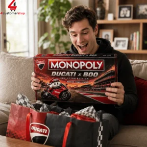 A man excitedly holding a Monopoly Ducati x Boo collector edition board game box.