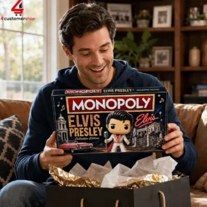 Man holding Elvis Presley Collector Edition Monopoly board game