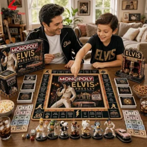 A father and son playing the Elvis Presley Collector Edition Monopoly board game at a wooden table.
