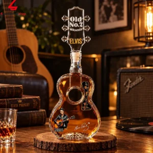 Elvis Presley themed guitar-shaped whiskey bottle decanter on a wooden base.