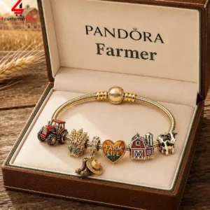 Pandora gold charm bracelet with farm-themed charms in a presentation box