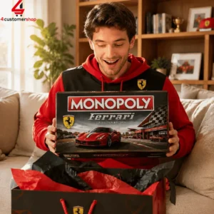 A man excitedly holding a Ferrari Collector Edition Monopoly board game box.