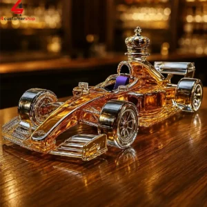 A golden Formula 1 racing car shaped liquor decanter.