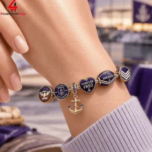 Fremantle Dockers AFL themed charm bracelet on a person's wrist