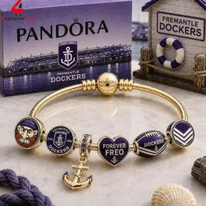 Pandora gold charm bracelet featuring Fremantle Dockers AFL team charms and logo packaging.