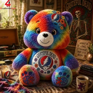 Rainbow tie-dye teddy bear featuring Grateful Dead imagery and iconic stealie logo.