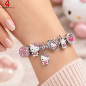 Silver charm bracelet featuring various Hello Kitty themed pink enamel charms on a wrist.