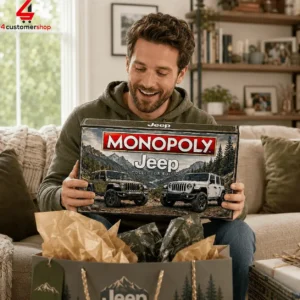 Man holding a Jeep Monopoly collector edition board game box.