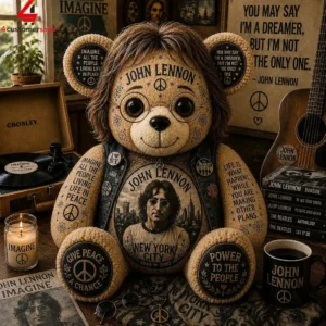 John Lennon themed teddy bear surrounded by music memorabilia and quotes