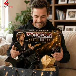 Man holding a Keith Urban Monopoly collector edition board game.