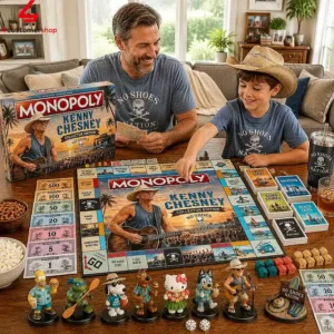 A father and son playing the Kenny Chesney Collector Edition Monopoly board game at a wooden table.