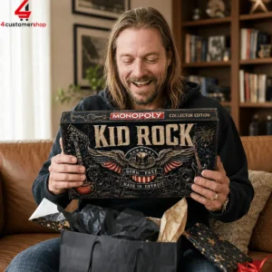 Man holding a Kid Rock Collector Edition Monopoly board game box.