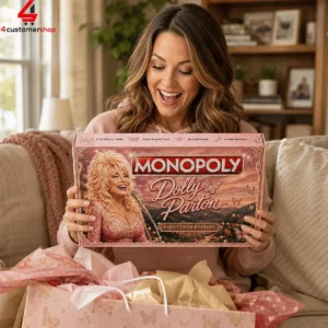 A woman enthusiastically holding the Monopoly Dolly Parton Collector Edition board game.