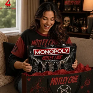 A woman holding a Mötley Crüe Monopoly collector edition board game.