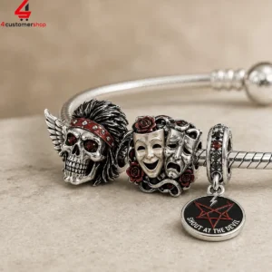 Sterling silver charm bracelet featuring skull and theater mask designs