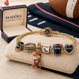 Ole Miss Rebels branded gold charm bracelet with school-themed charms in a gift box.