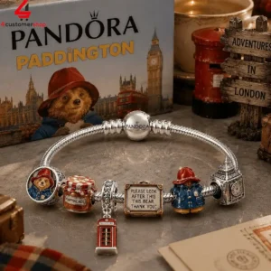 Pandora Paddington Bear charm bracelet with London-themed accessories.
