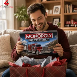 Man holding a Peterbilt collector edition Monopoly board game box