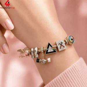 Close-up of a Pink Floyd themed charm bracelet on a wrist