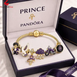 Prince-themed gold Pandora charm bracelet in a branded gift box