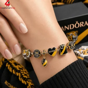 Richmond Tigers themed gold charm bracelet on a wrist